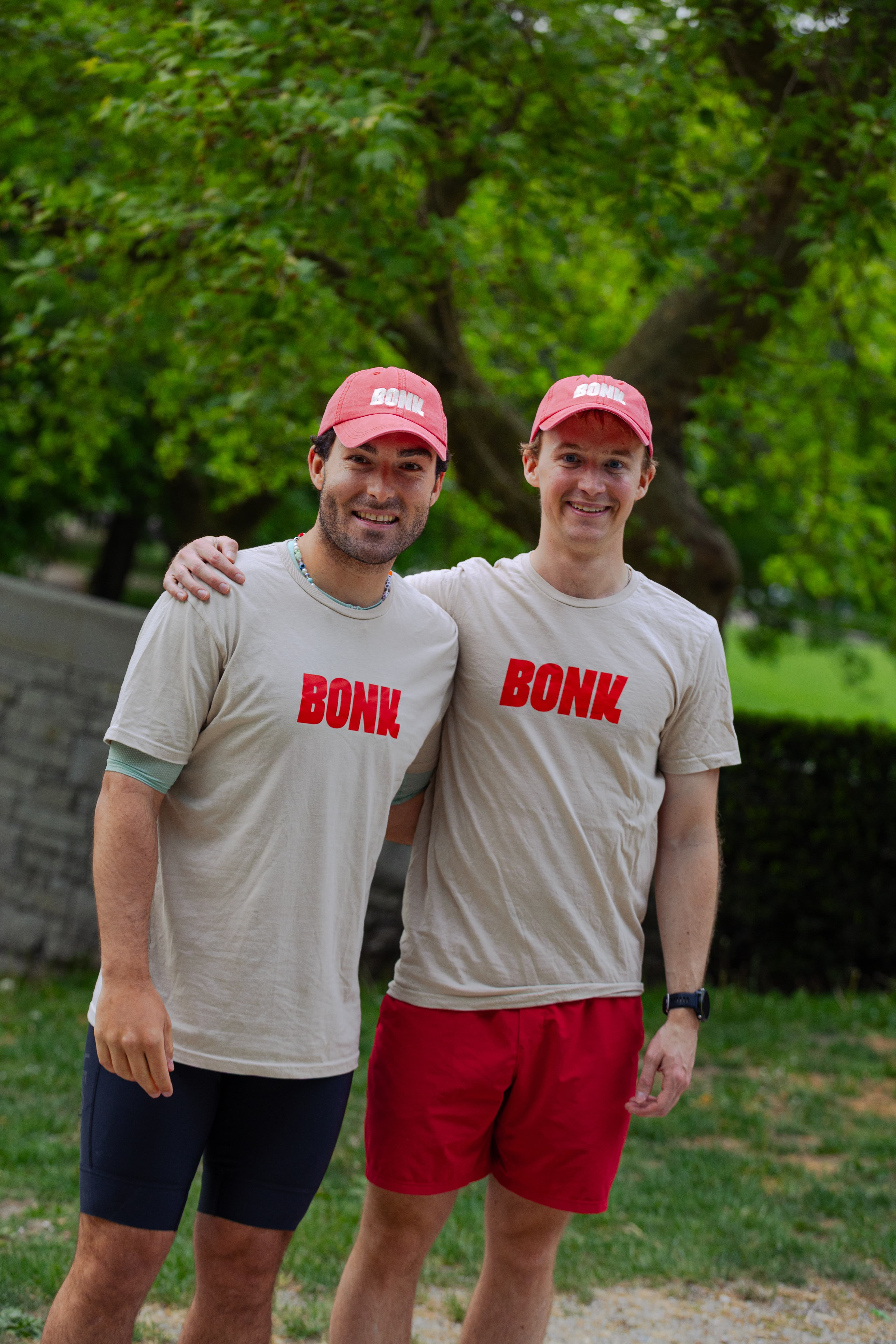 Ansel Gravelle and Devin Gordon standing together in BONK hats and shirts
